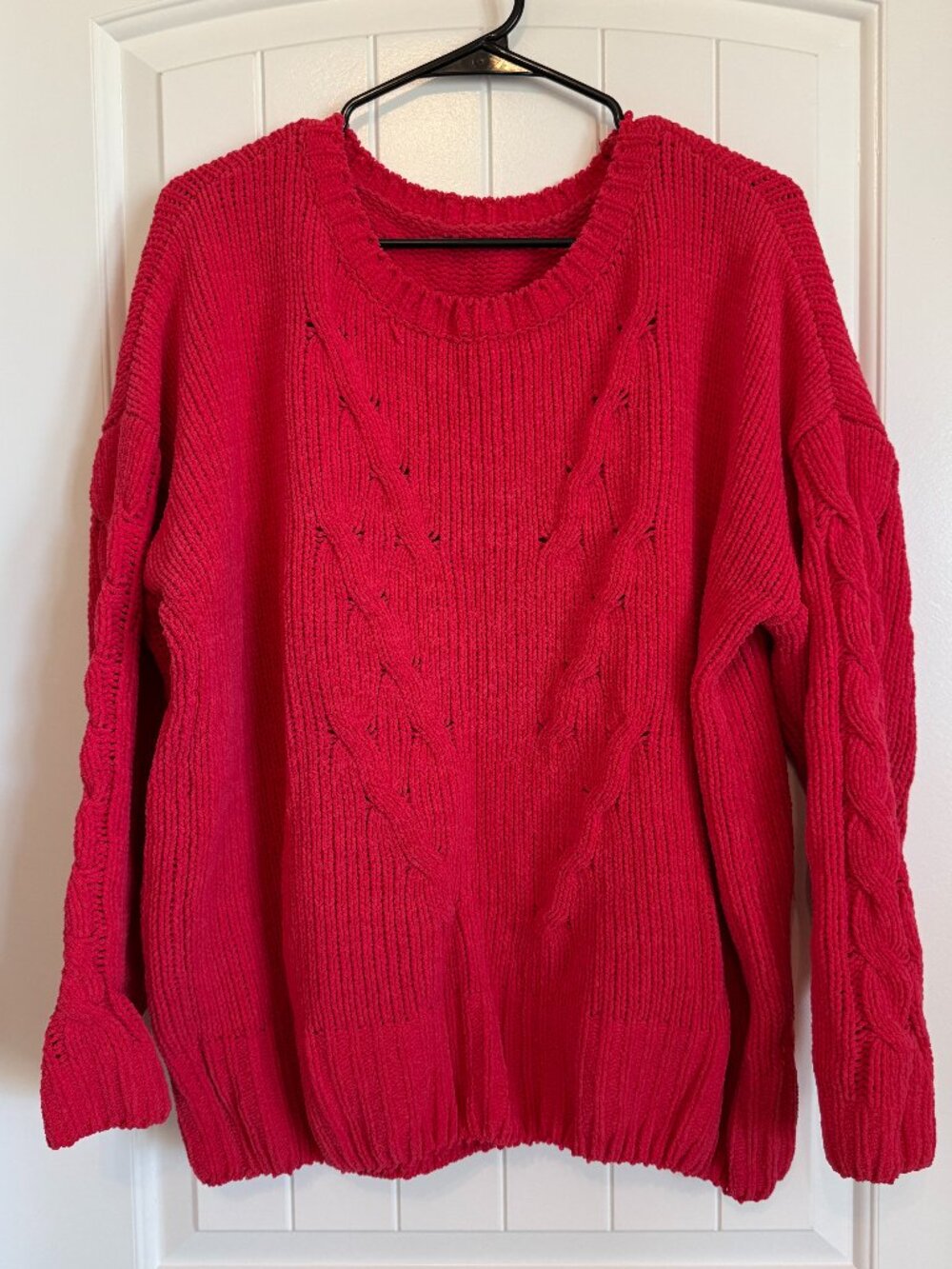 Cozy oversized hot pink sweater with a classic crew neck and braided pattern